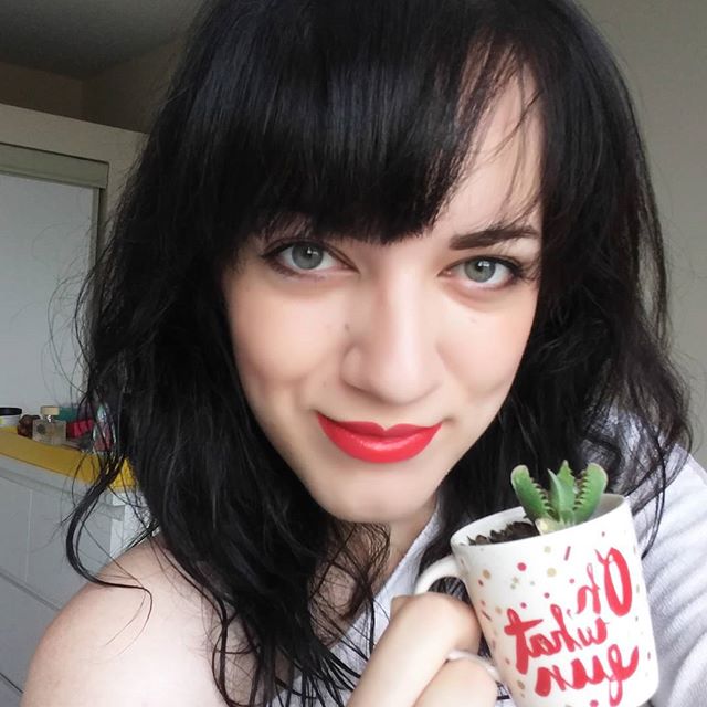 Just noticed I match the espresso cups I planted my succulents in! Green eyes, green plant, red lips, red text. Gotta water these babies before I fly.