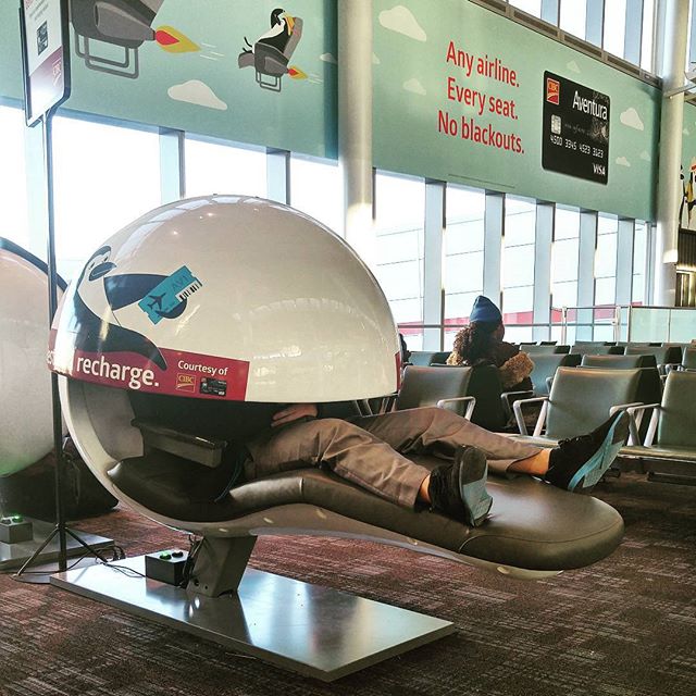Is that pac man with a tongue? Nope, just a dude sleeping. These pods must be comfy but they look hella awkward.